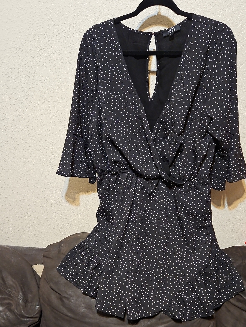 OHS Black Polka Dot Wrap Romper with Ruffle Hem